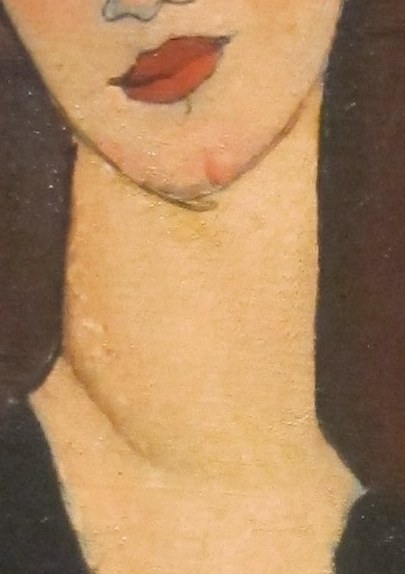 Her long neck is a signature feature.