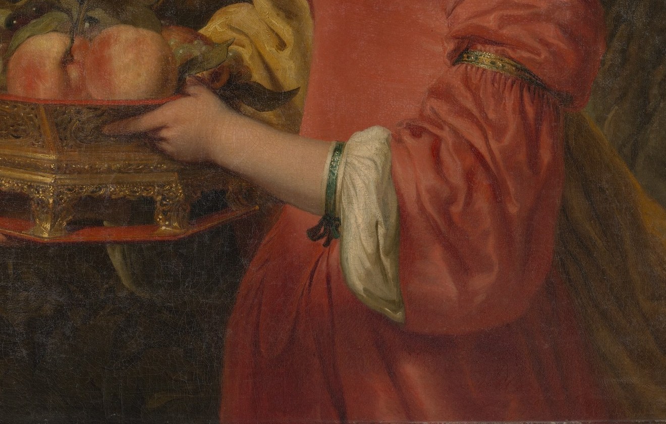 Look at what she's holding. It isn't just a pretty gift.