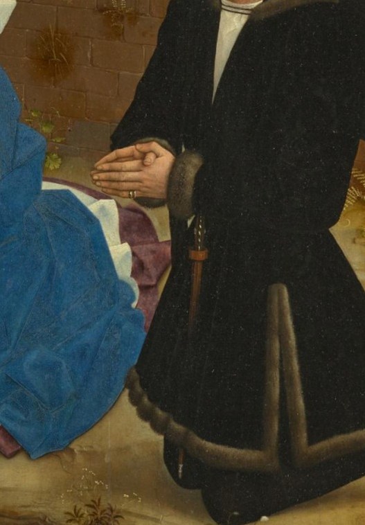 His awe-struck expression and humble posture show reverence for the newborn.