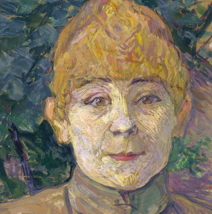 Her face shows a weariness, a quiet defiance.