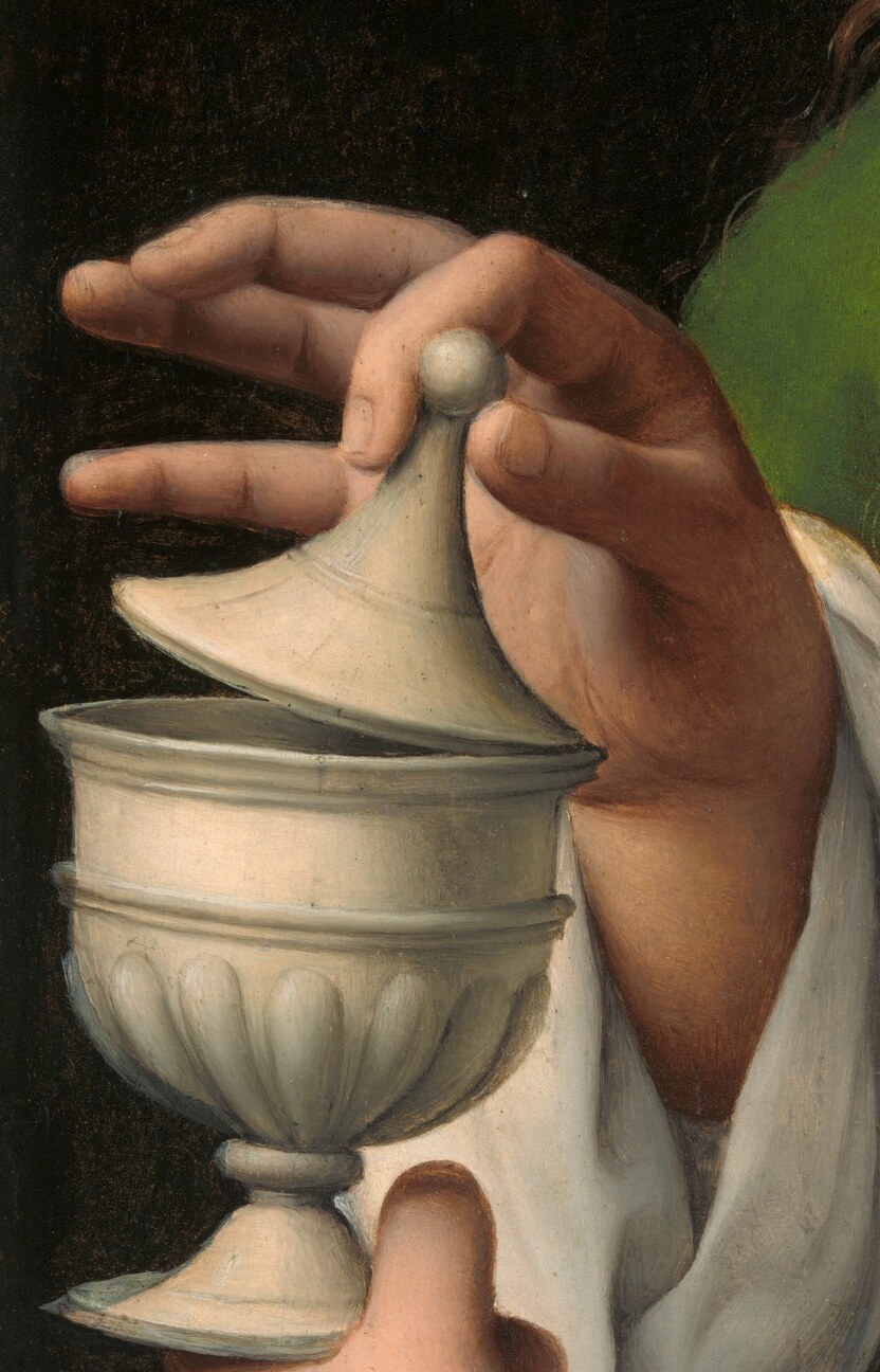 See how her hand gently holds the lid.