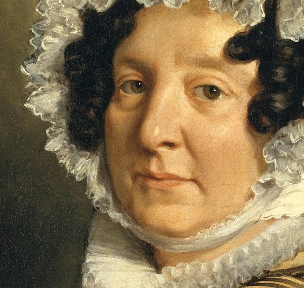 Her direct gaze meets the viewer.