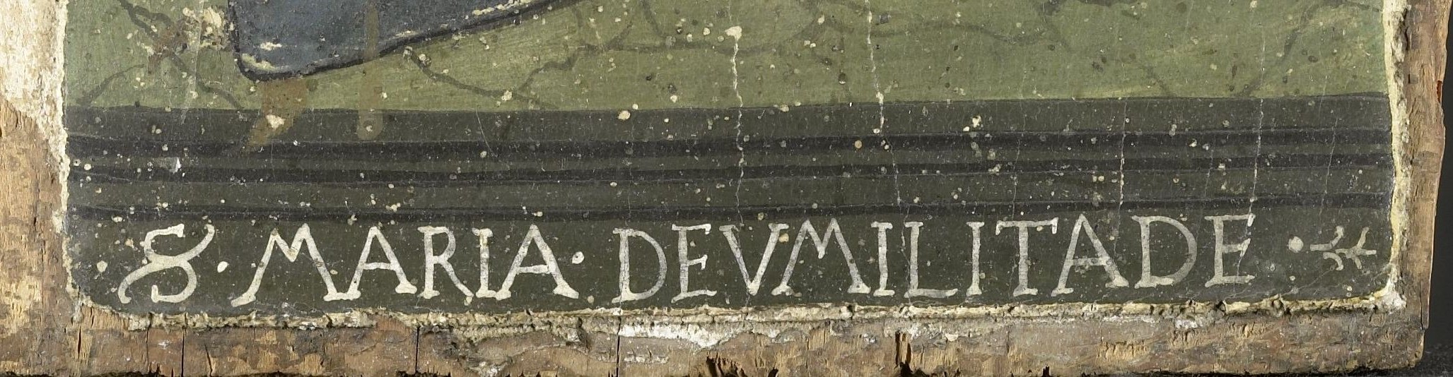 The dedicatory text names the iconographic type explicitly , unusual to have it directly on the painted surface rather than a frame.