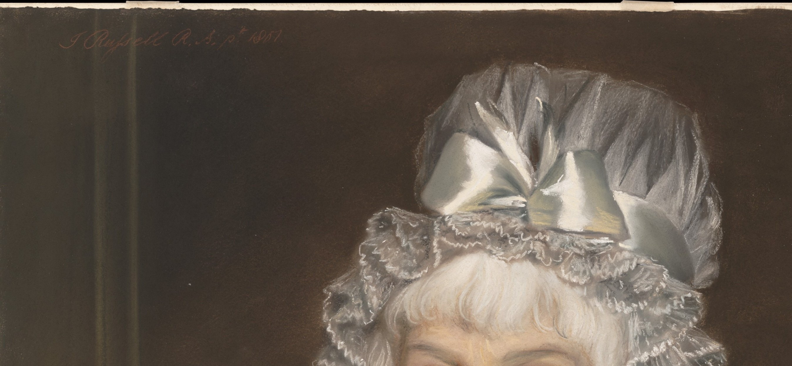 Dominates the composition; the voluminous gathered lace was the height of 1801 English fashion and signals mature respectability over youthful display.