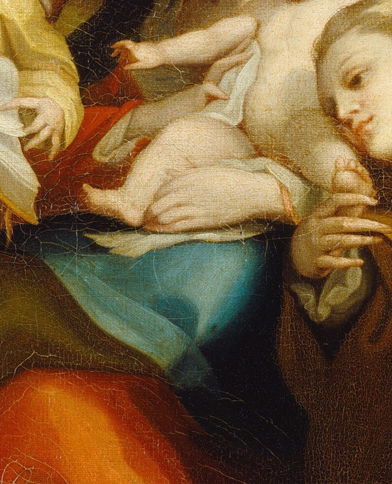 The Madonna cradles her child, presented for worship.