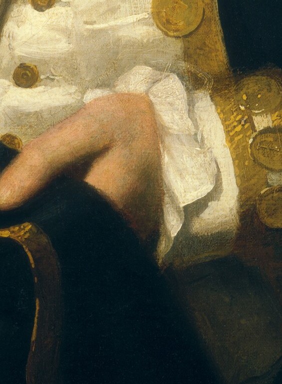But his left hand, resting lightly, reveals a subtle tension.