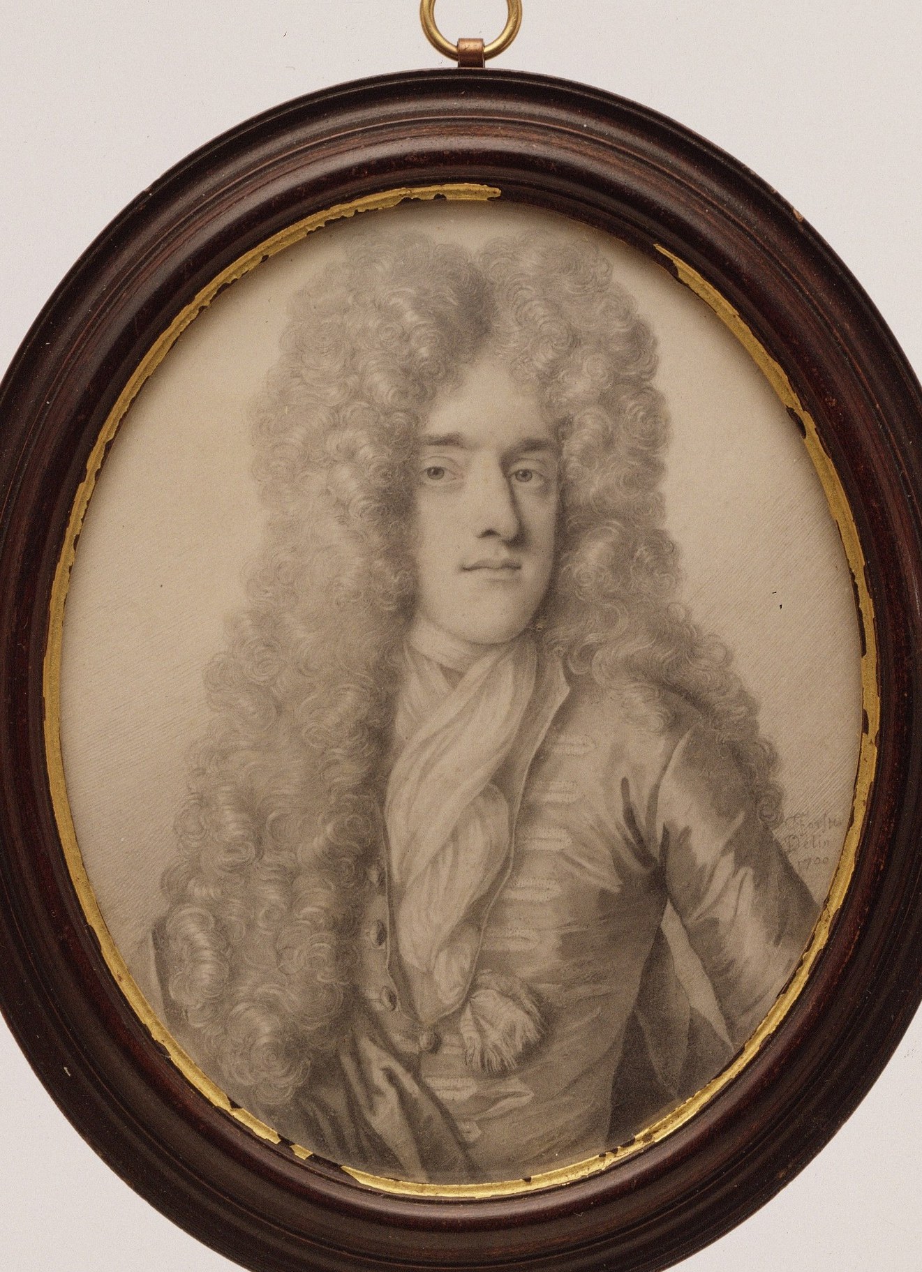 The oval format is a common convention for portraits of this period, focusing attention on the sitter.