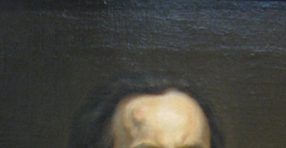 A receding hairline. A broad, lit forehead.