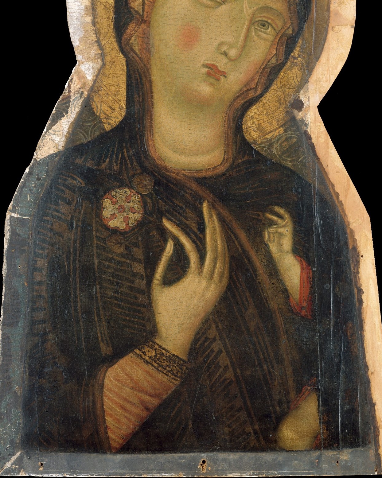 The enveloping veil, once costly lapis lazuli now darkened with age, carries a foreshadowing heaviness , Byzantine Marian iconography codes dark blue as mourning.
