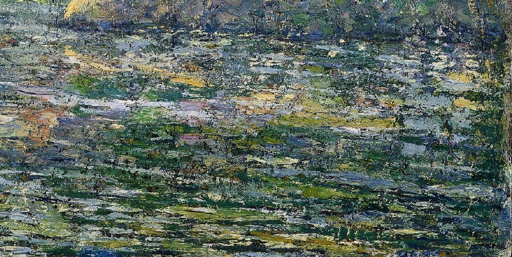 The painter uses thick paint to build texture.