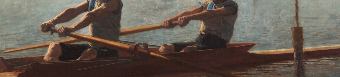 The oars blur in their powerful stroke.