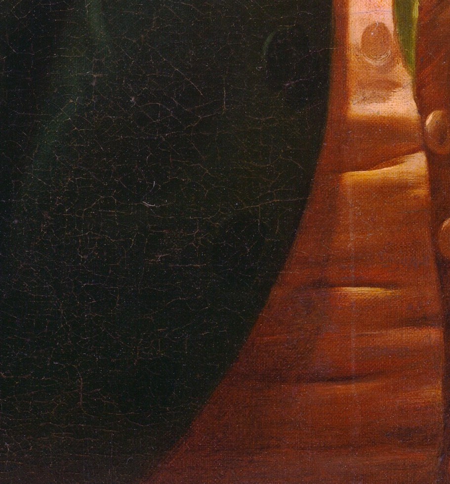 A single, creamy rose was not typical for a male portrait.