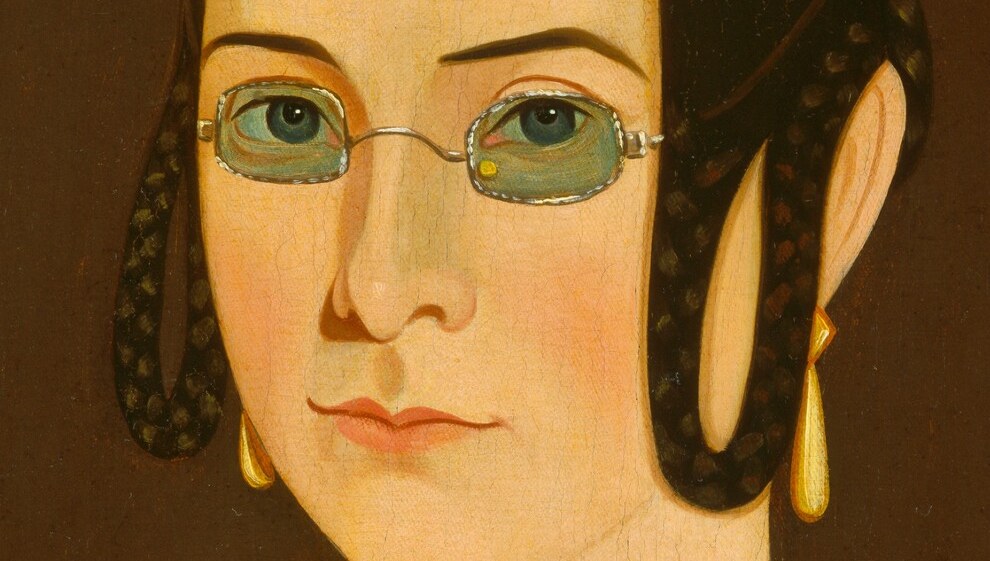 This painter shows her clearly, even highlighting her wire-rimmed glasses.
