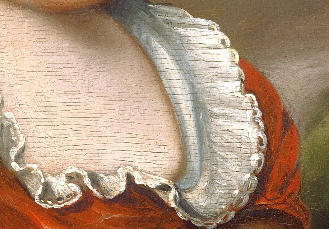 It is carefully adorned with white lace and ribbons.