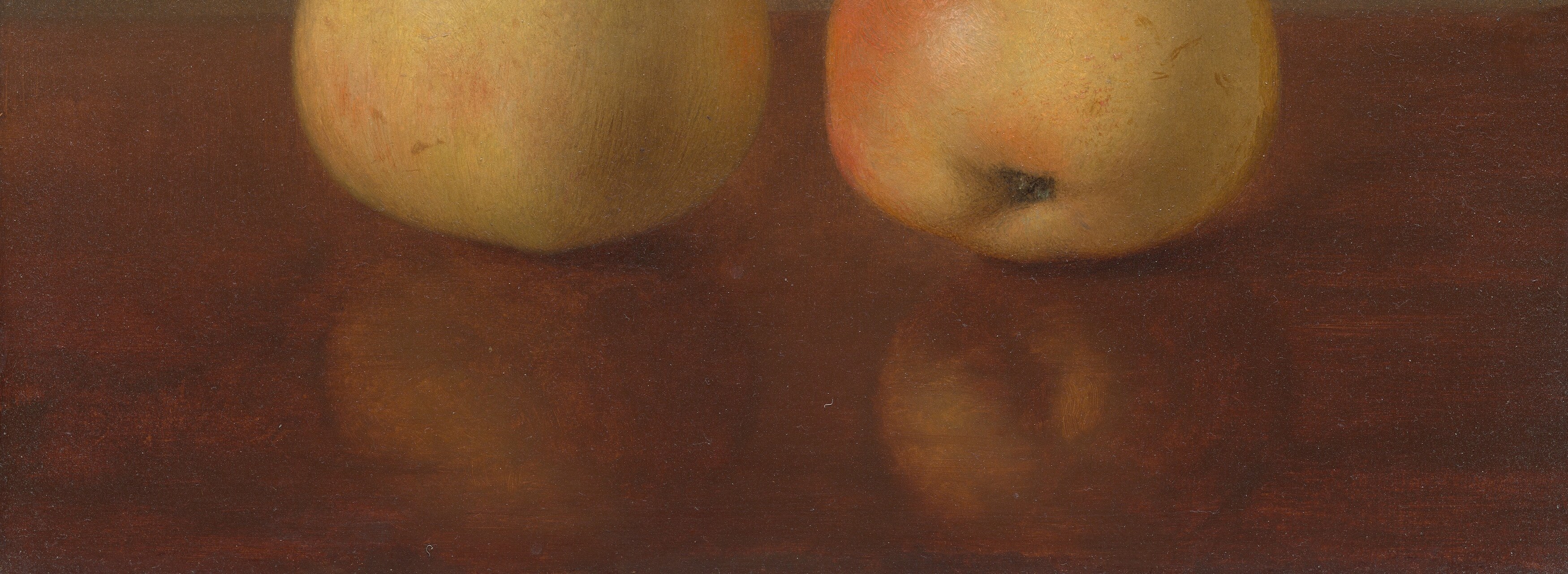 The polished, dark wood provides a rich, grounding contrast to the pears, emphasizing their form and color.