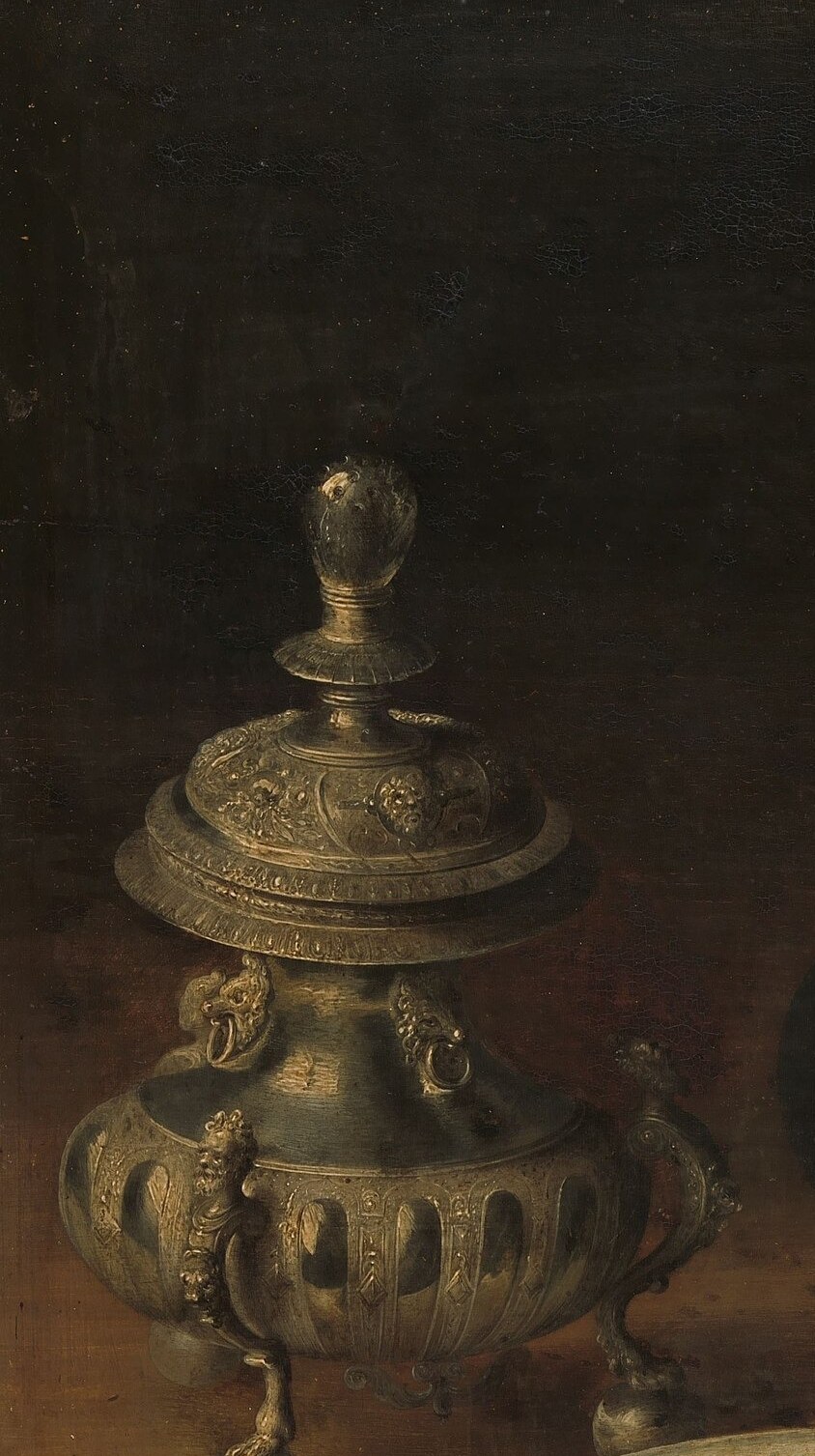 Elaborate silverwork demonstrates the goldsmith's craft and the host's status; sugar itself was a rare, expensive commodity at this date.
