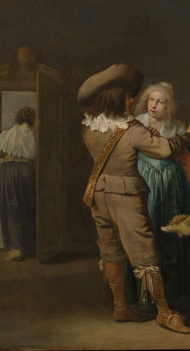 Look at the man in the wide feathered hat.