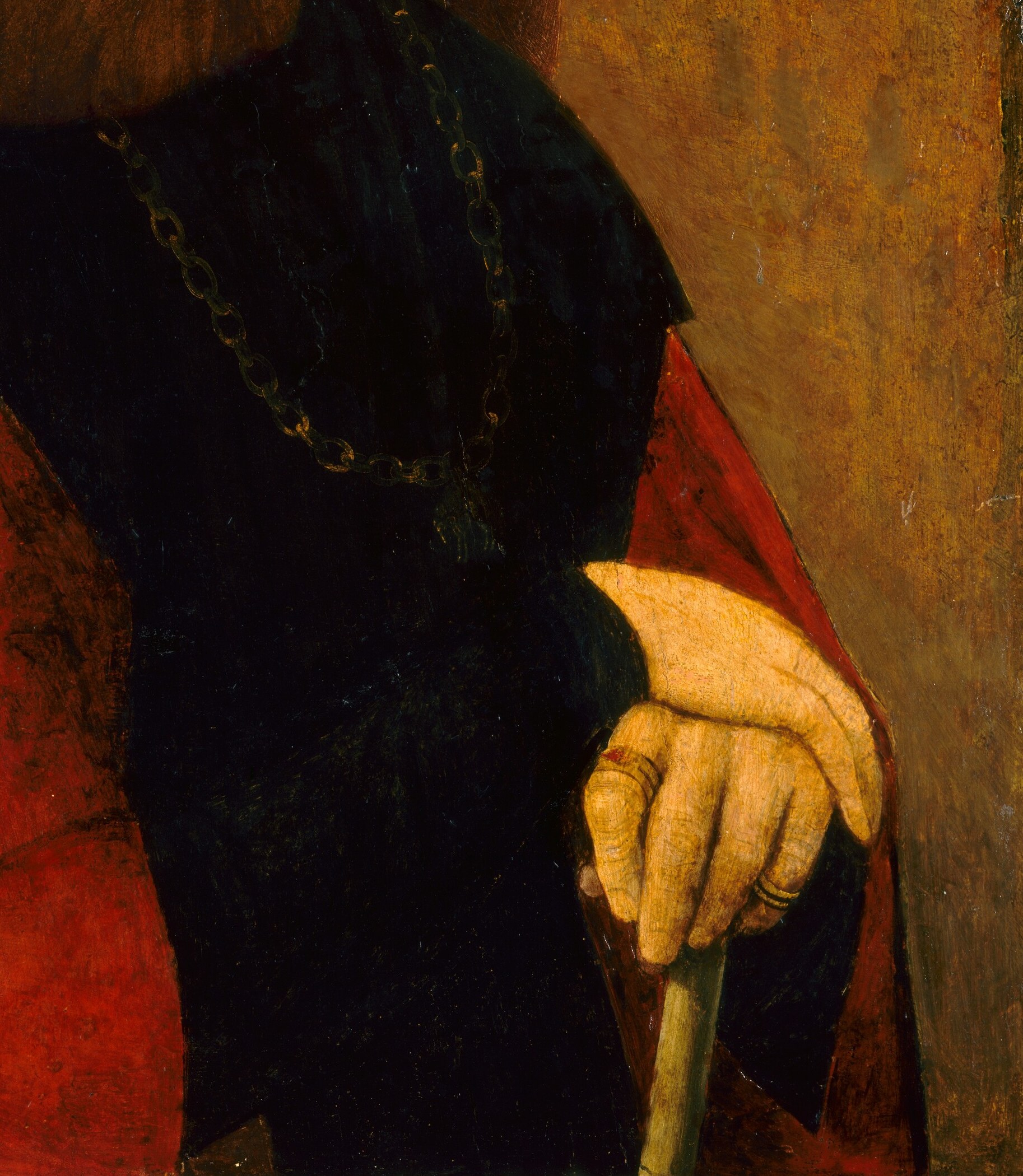His vivid red cape suggests his high rank.