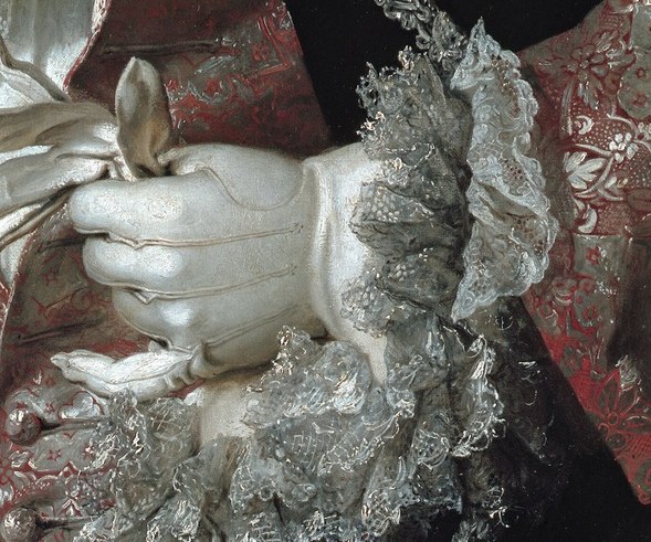 His white-gloved hands hold a black hat and an open jeweled case.