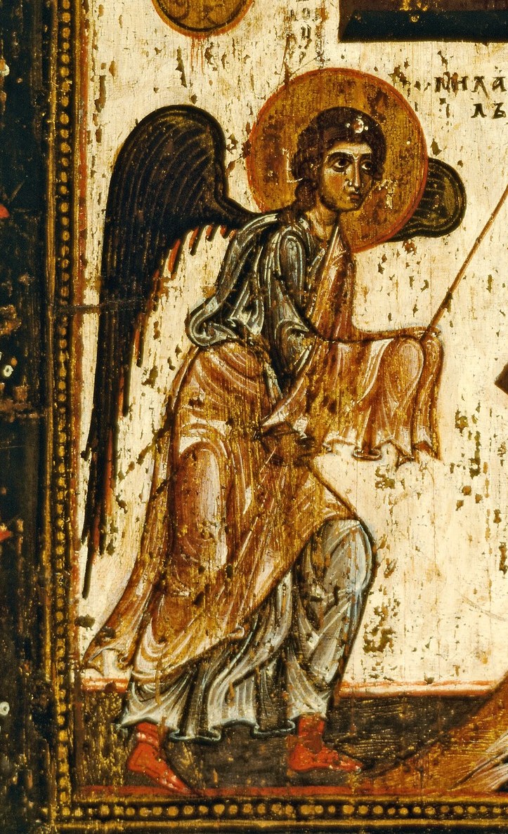 Two large angels frame the cross, in solemn reverence.