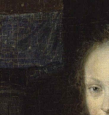 Her direct gaze meets ours.