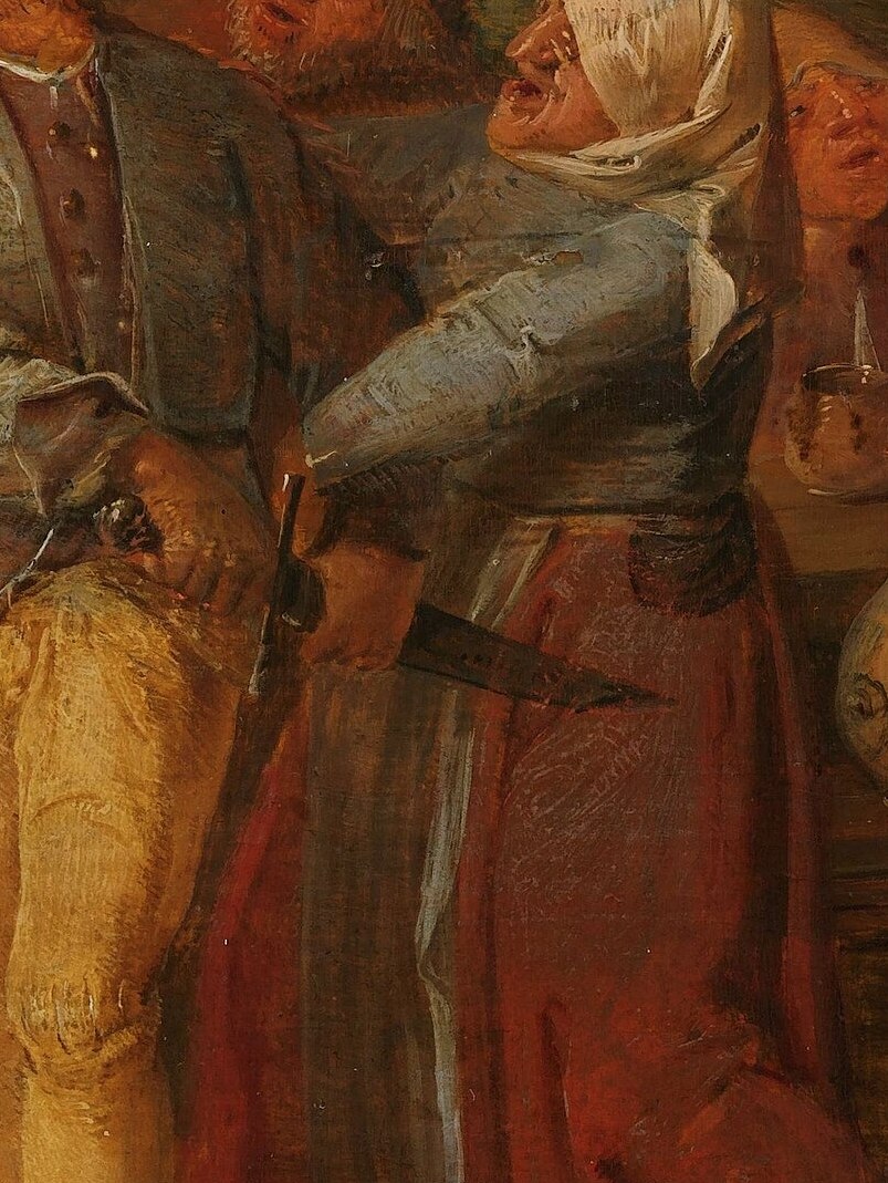 Her intense gaze and the way she leans in suggest she is either involved in the argument or observing it with great interest.