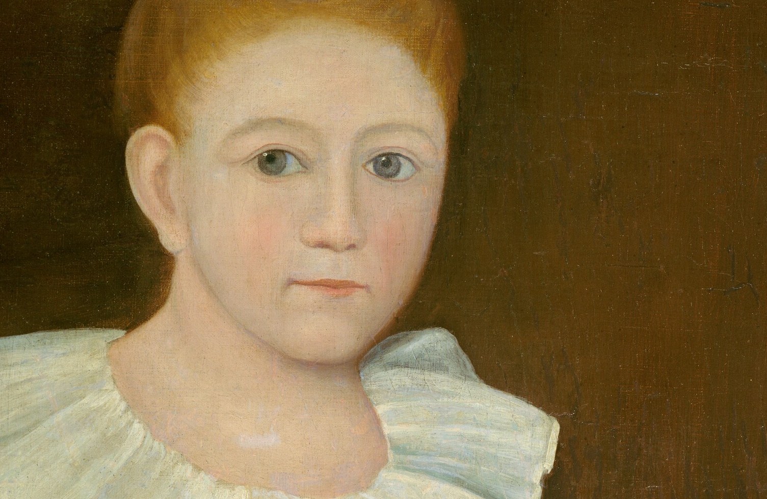 Their expressions convey a youthful innocence and connection.