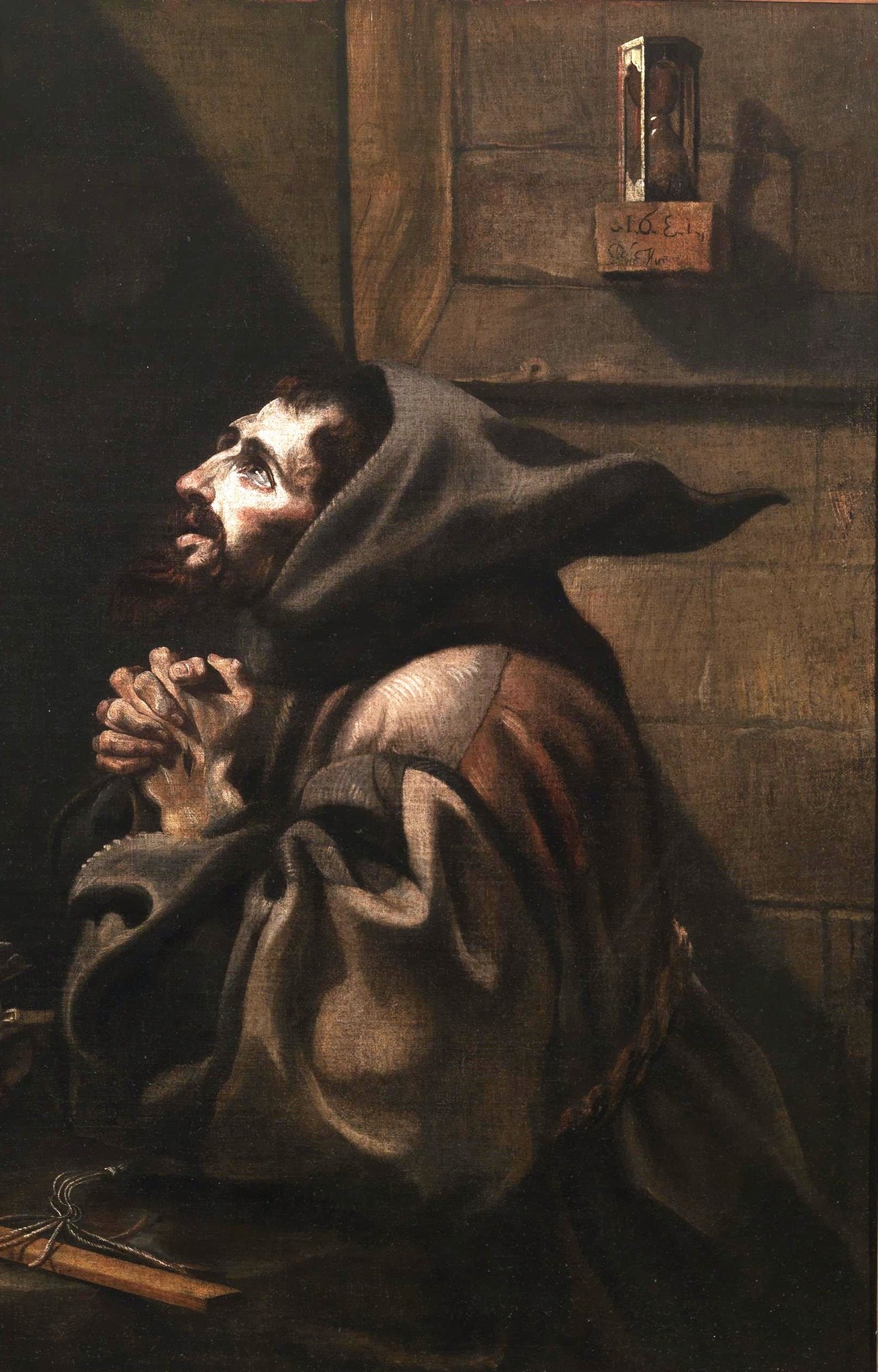 Dramatic light and shadow highlight the saint's intense feeling.