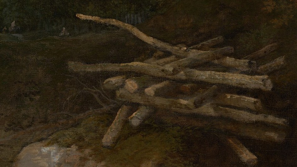 A pile of freshly cut logs tells us people lived and worked here.