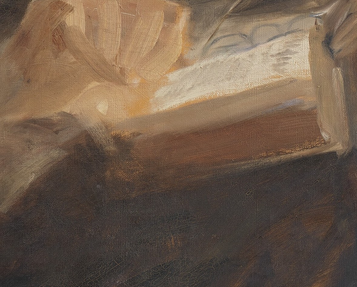 The text is illegible, emphasizing the act of reading or contemplation rather than specific content.