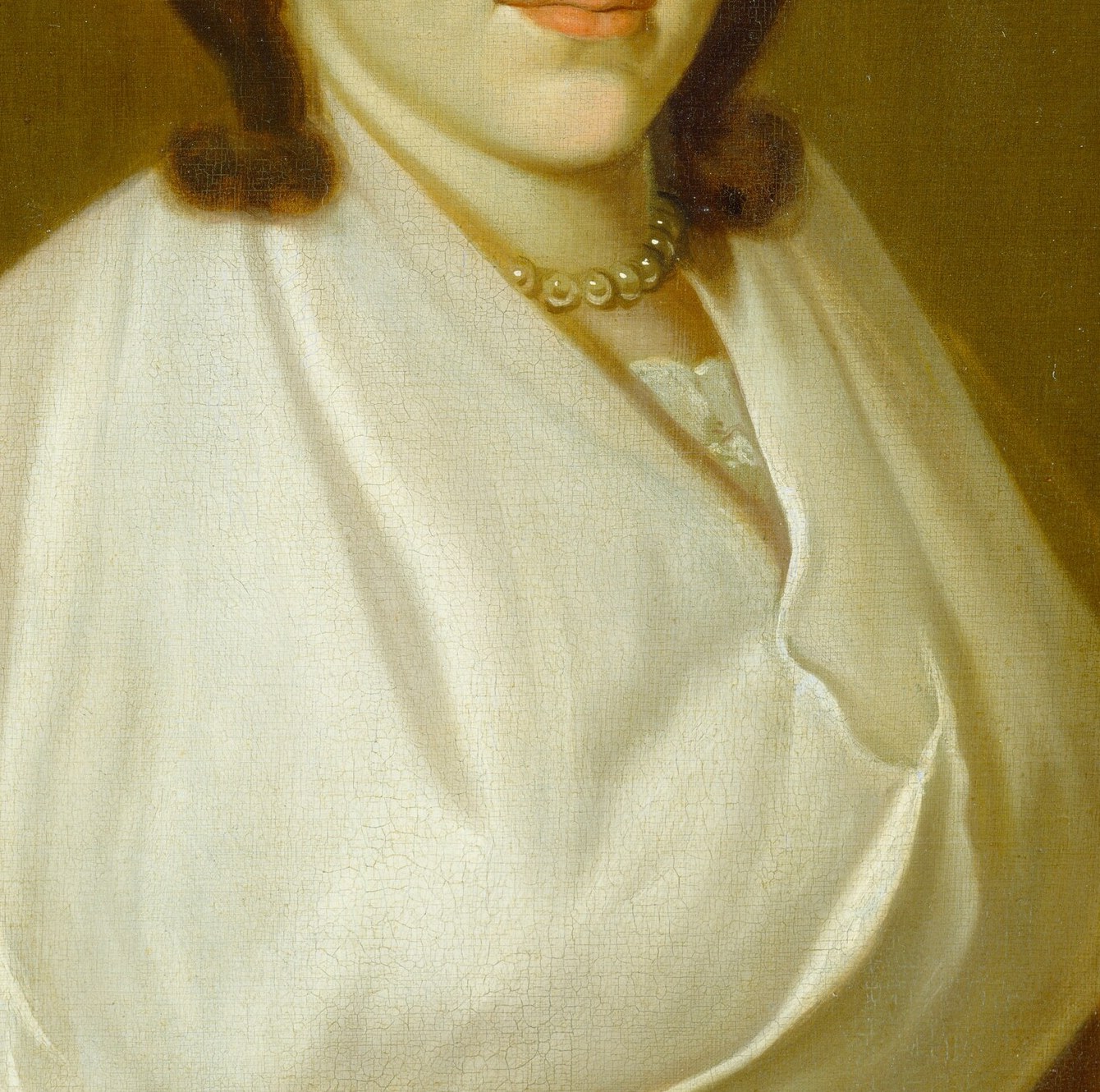 The soft folds of her white dress show the painter's skill.