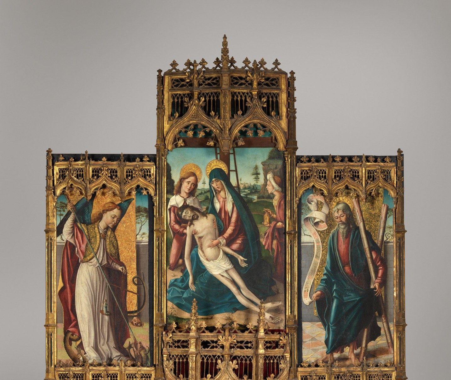 The frame is itself a work of craftsmanship , the interlocking gold pinnacles and cusped arches reveal that the altarpiece was built to be read as a miniature cathedral.