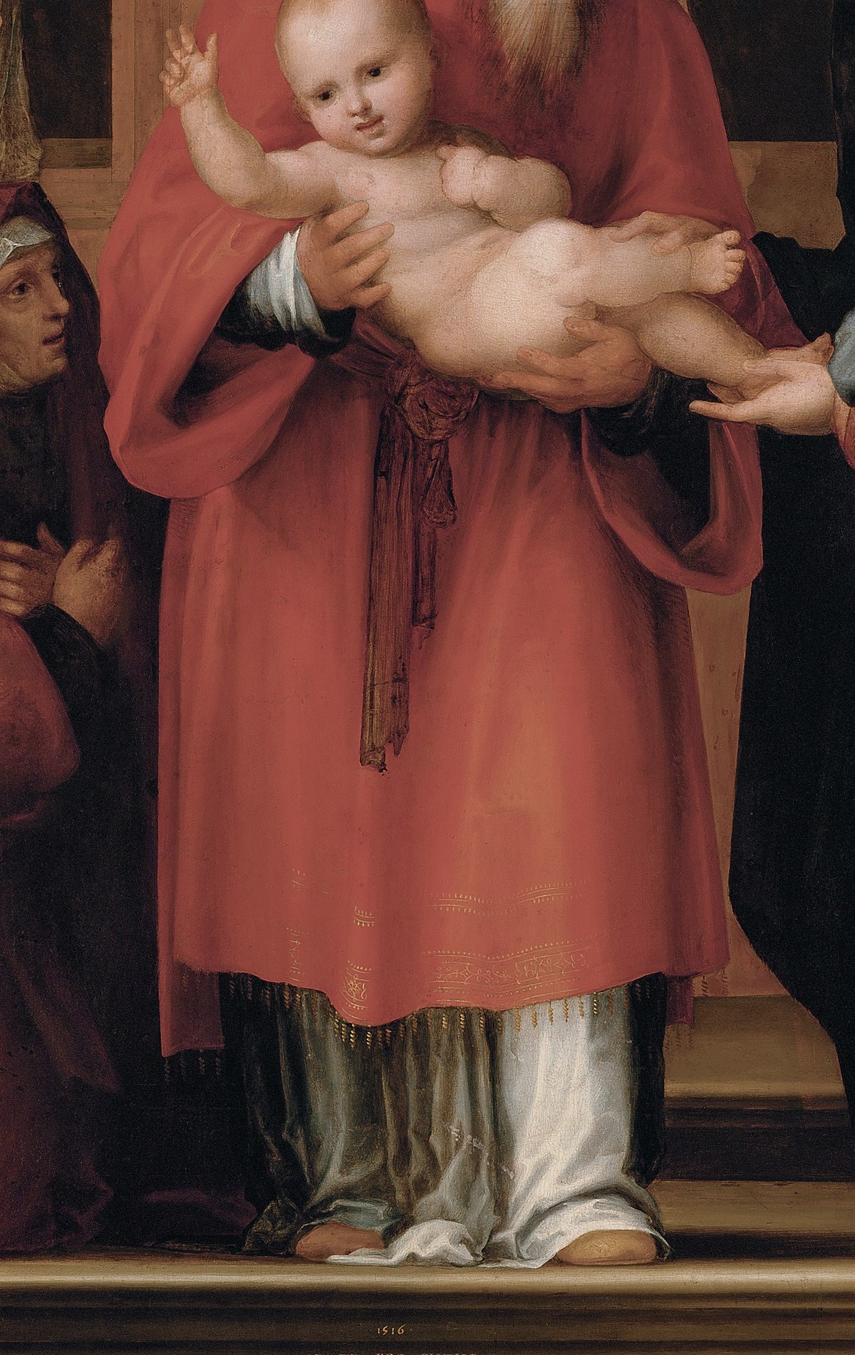 His serene expression and the way he cradles the child convey a sense of reverence and duty.