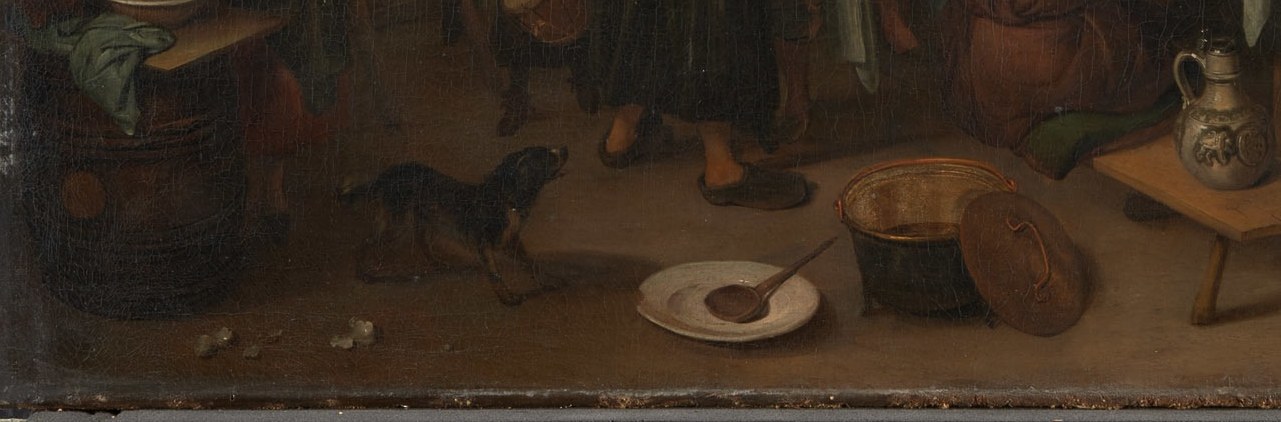 Overturned hat, discarded scraps, and possibly a dog or cat, the celebratory mess underfoot is a moralizing detail common in Dutch holiday paintings, contrasting festivity with disorder.