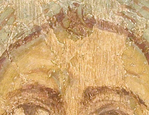 His deep-set eyes hold a steady, contemplative gaze.