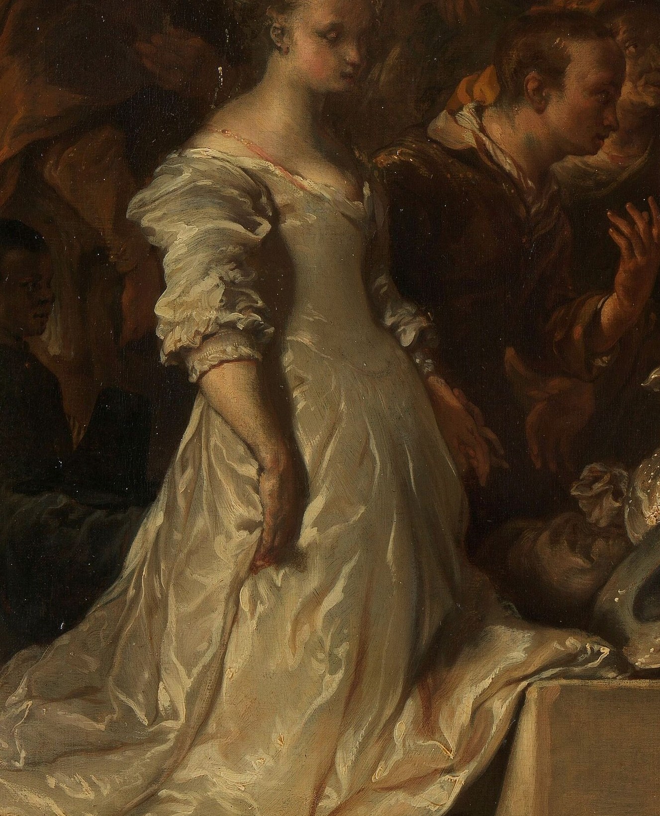 Her satin dress holds every drop of light in the room.