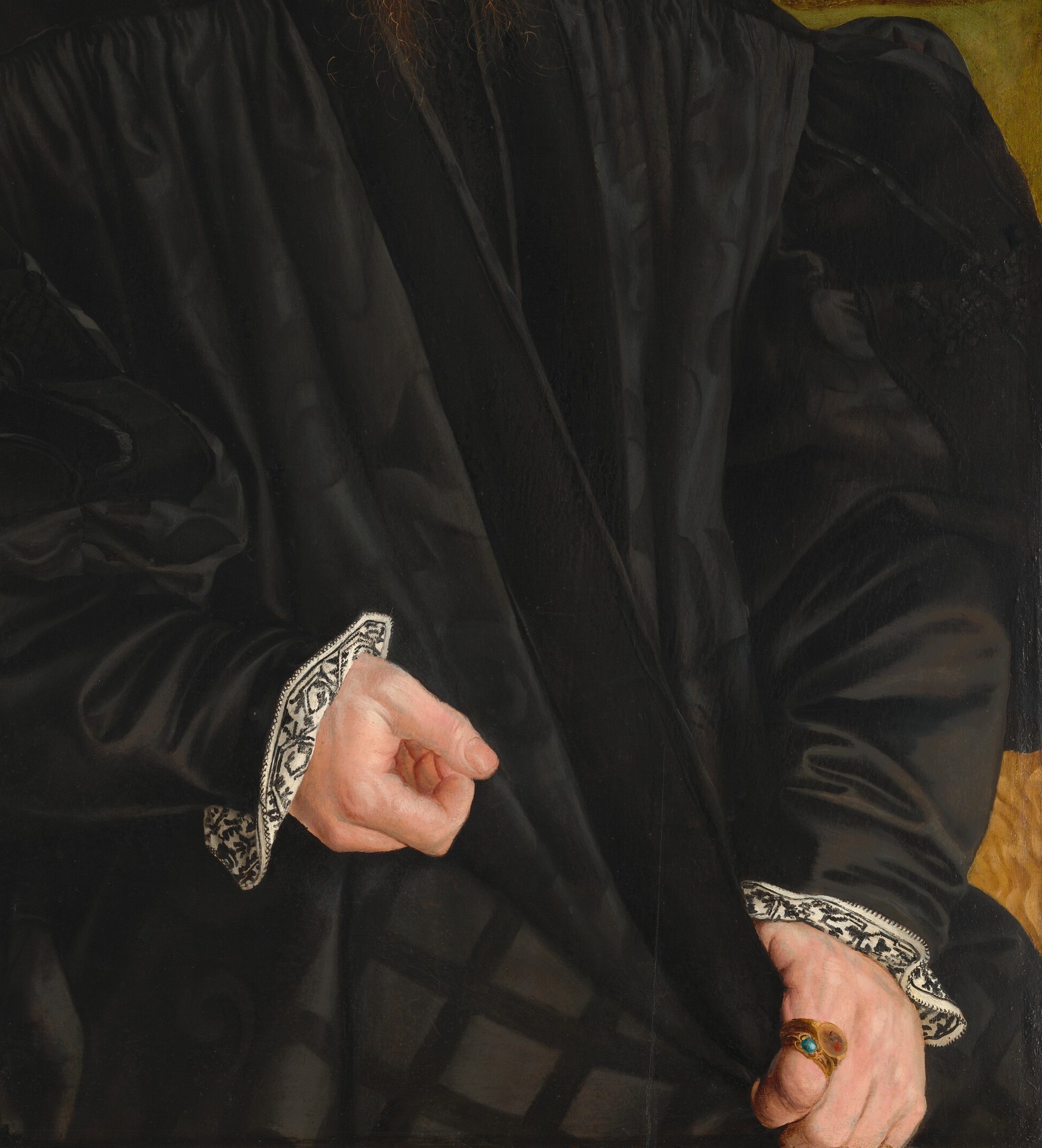 His dark cap and robe show a man of status.