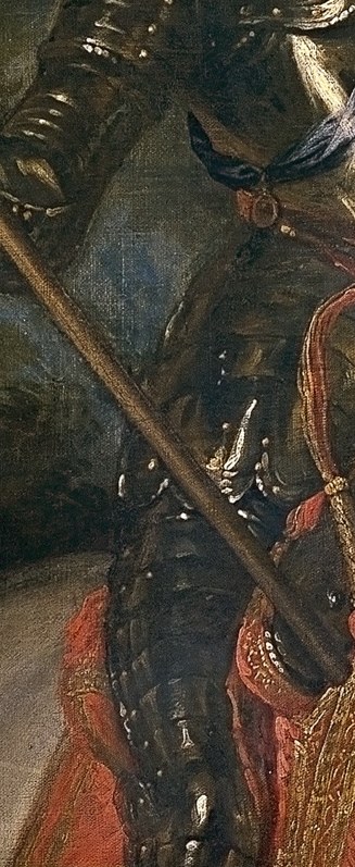 Look at his commander's staff, a symbol of authority.