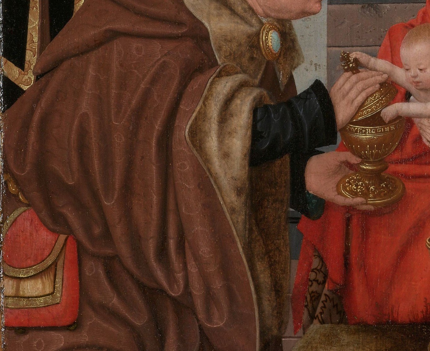 His robe is woven with gold thread.