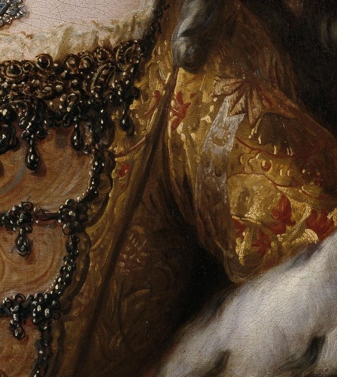 Her portrait emphasizes wealth and royal status.