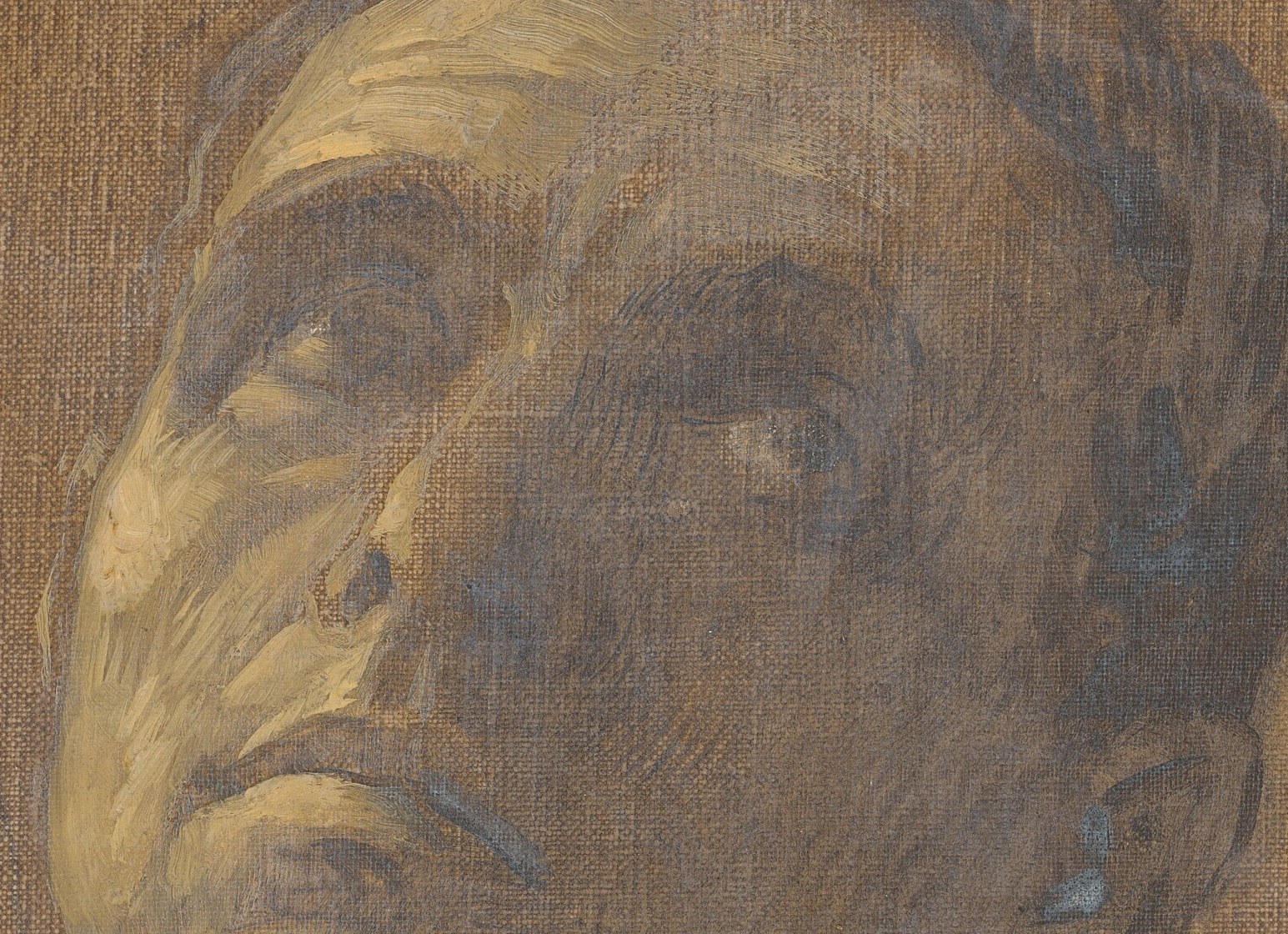 His upturned eyes suggest an inner world, unseen.