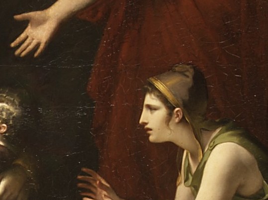 A kneeling woman raises her hands. Grief made physical.
