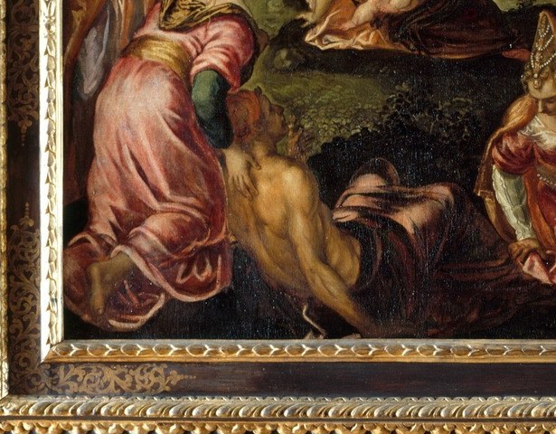 A maternal anchor figure whose downward gaze and settled posture suggest reverence or the act of receiving , the human face of the multitude