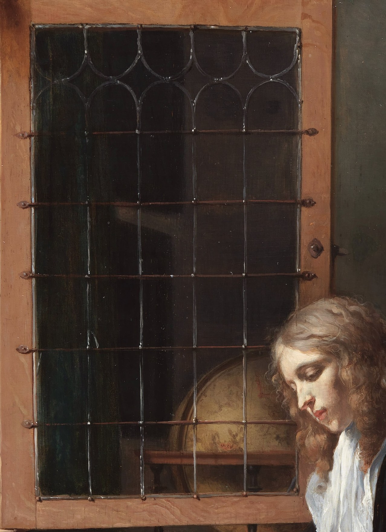 The quiet room, bathed in soft light, holds his focused attention.