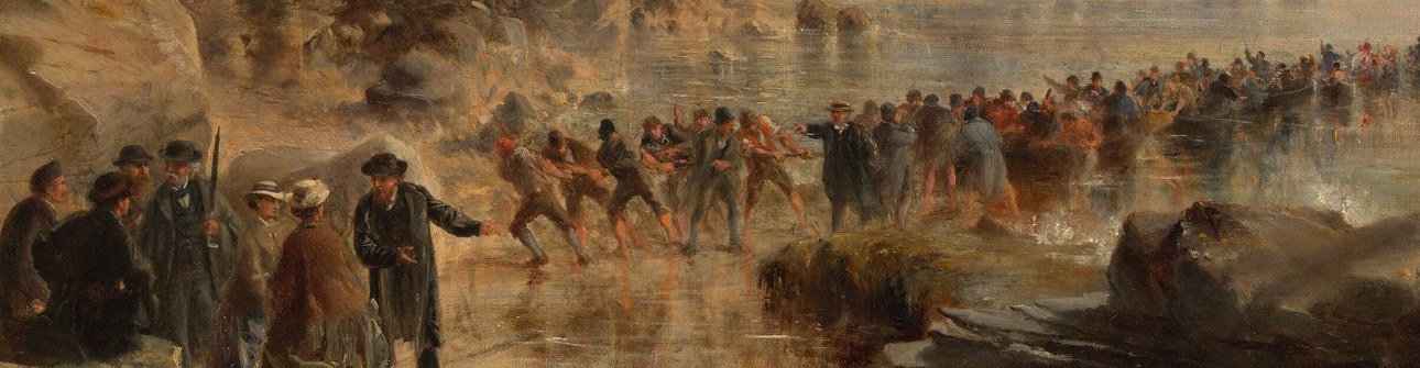 Men wade into the surf to haul it ashore.