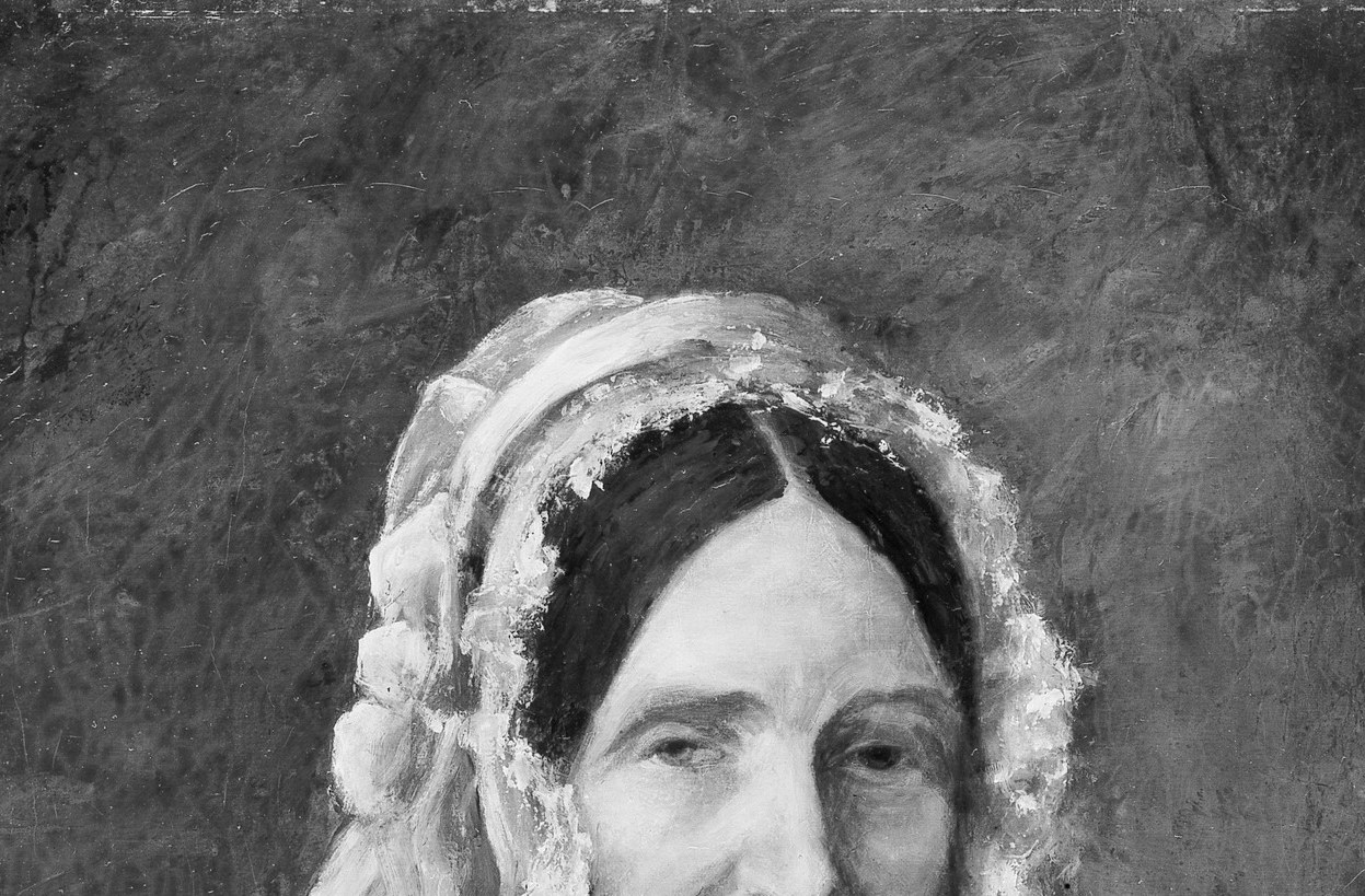 Her white lace cap marks her as respectable.