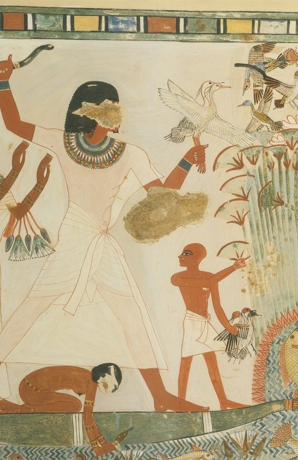 The dominant hierarchically-scaled figure; his outsized height signals elite status , a core Egyptian convention visible at a glance