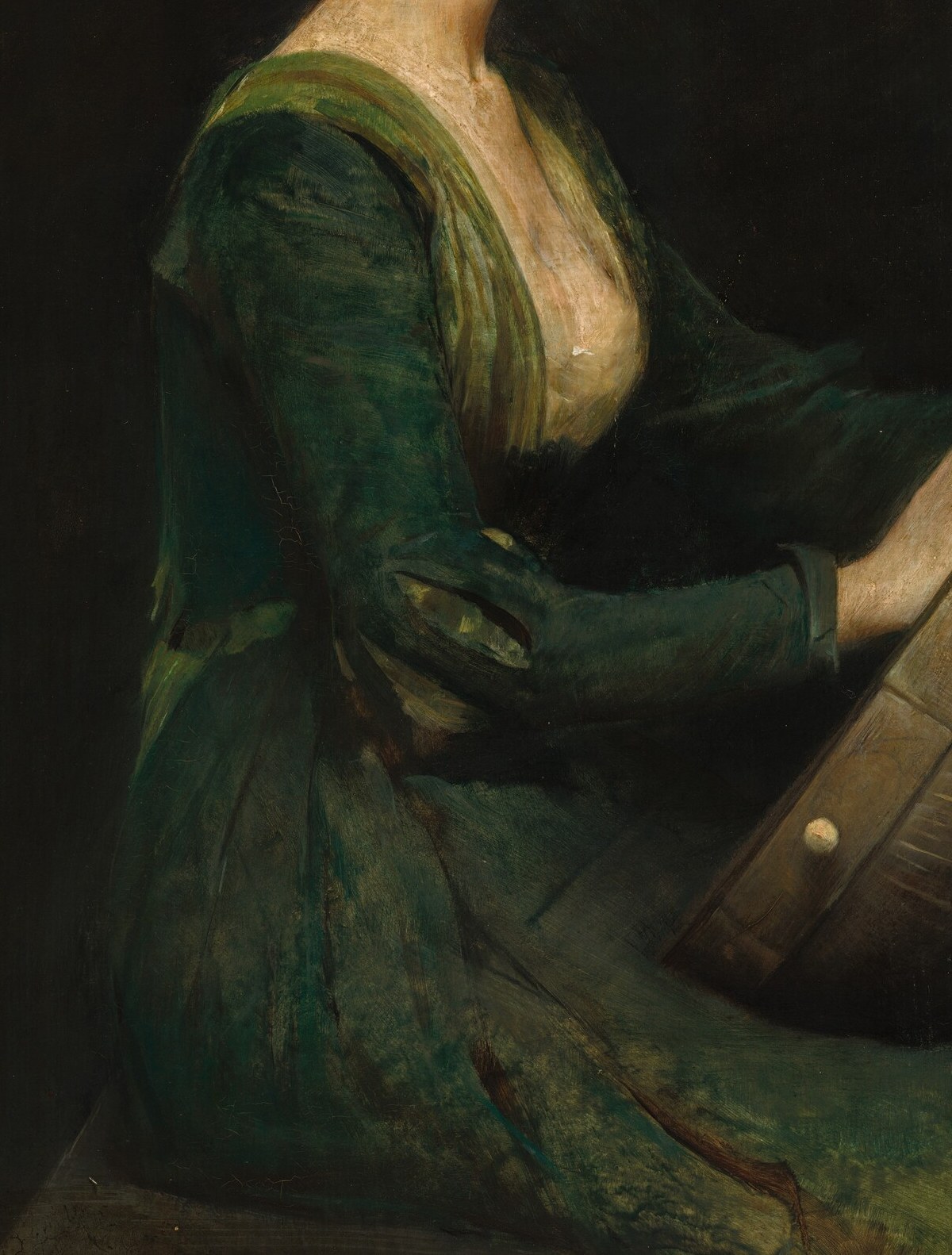 The muted green gown adds to the contemplative mood.