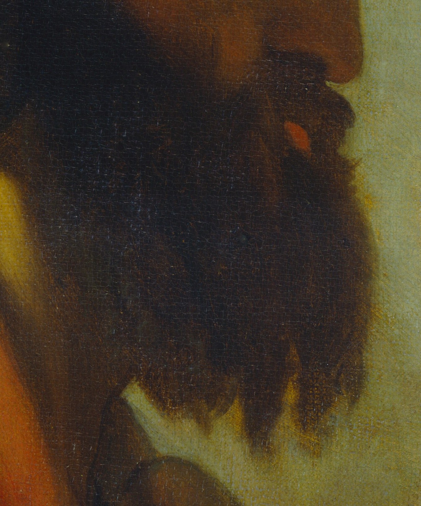 His shadowed face and dark beard suggest a complex inner world.