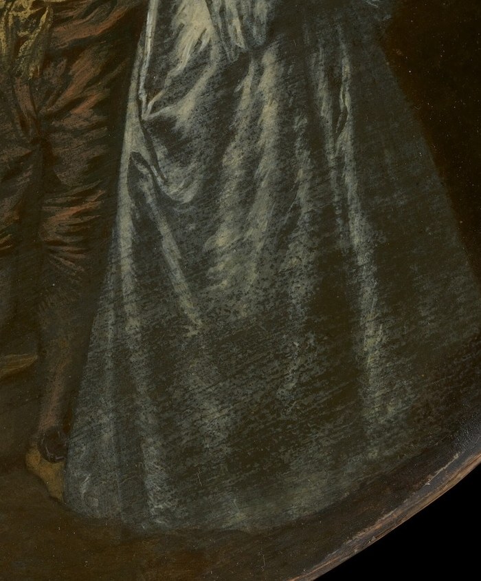 The woman's dress holds soft light.